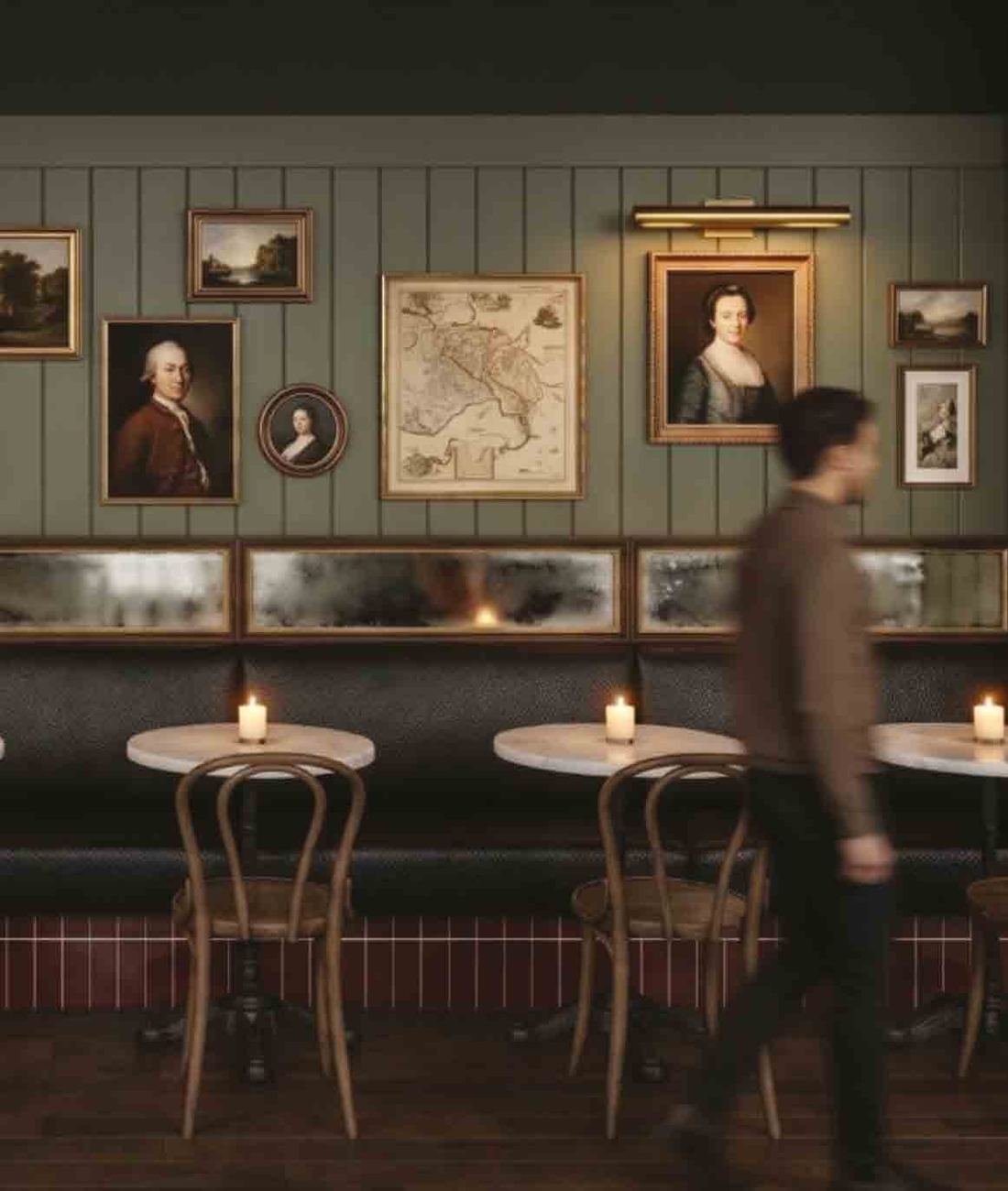 Candlelit interior of Juniper with a curved wooden bar