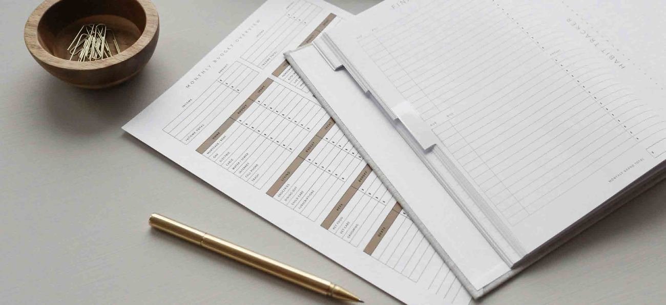 Papers and a pen on a desk