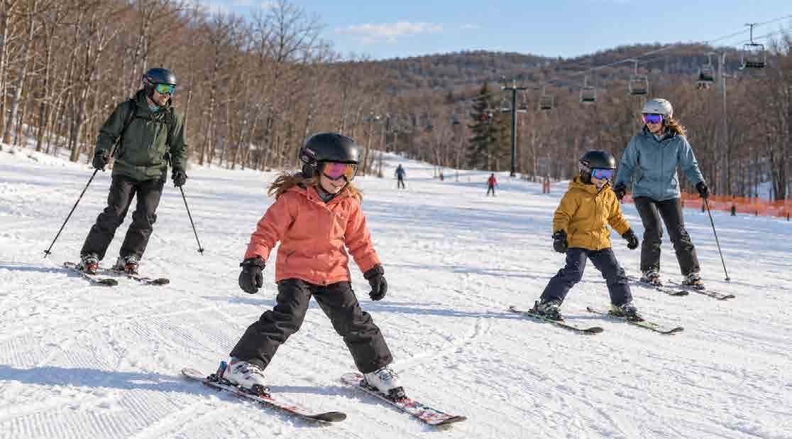 Children skiing on a snowy slope